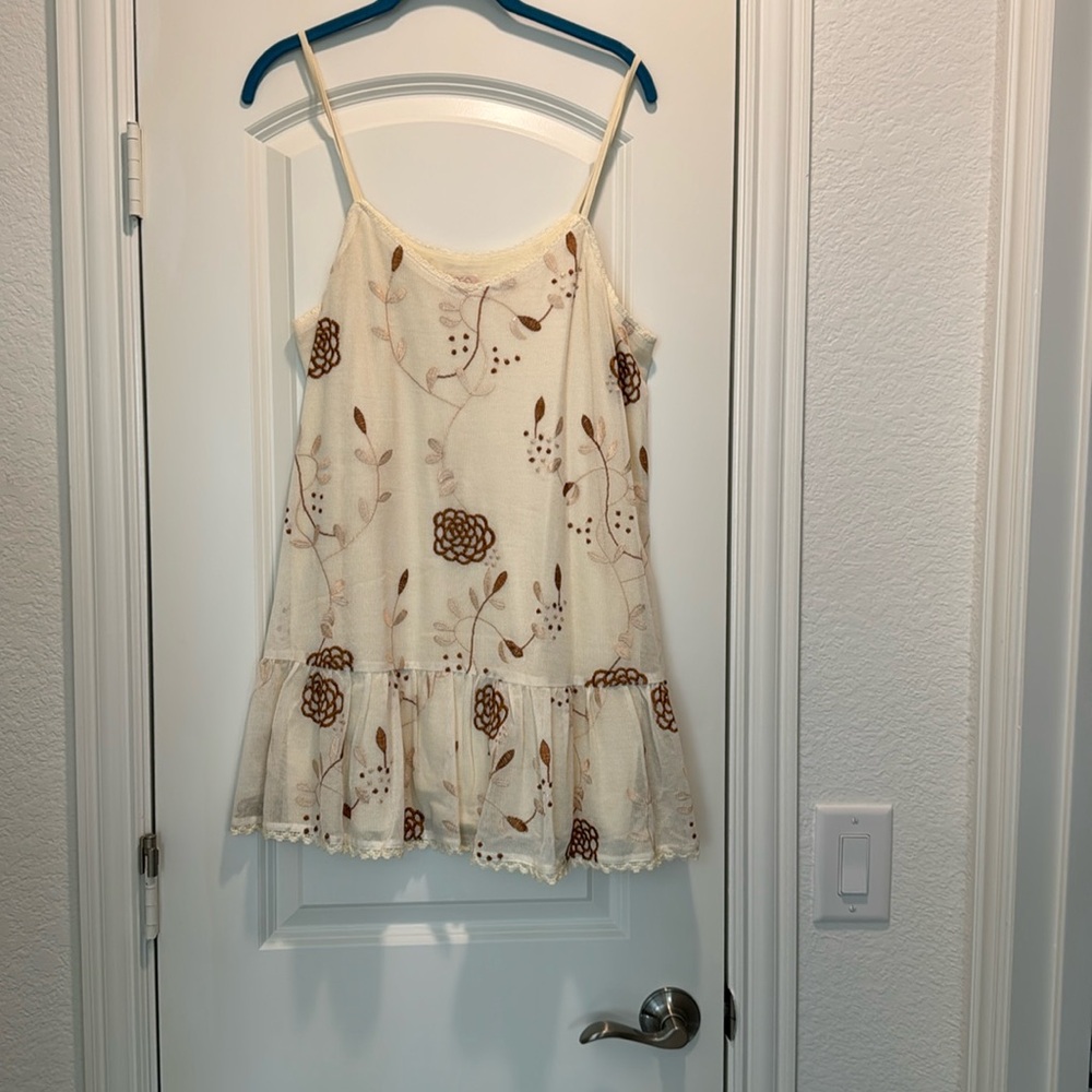 Logo adorable sleeveless Cami with ruffle bottom layering piece